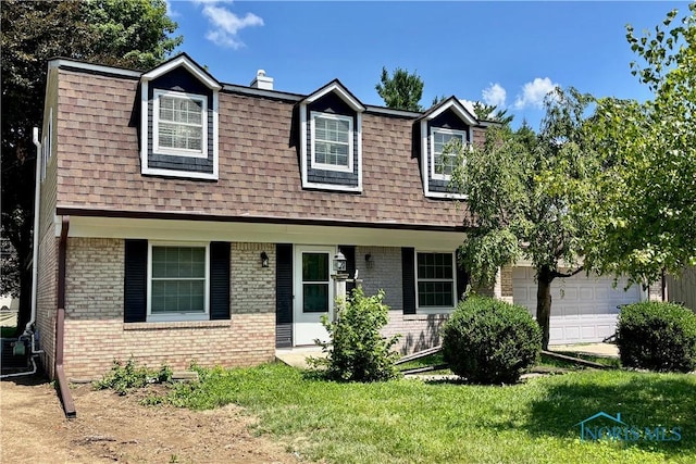 1085 Birch Dr, Perrysburg, OH 43551 - view of front of house featuring brick siding, roof with shingles, and a chimney