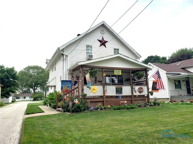 254 Fremont St, Elmore, OH 43416 - rear view of property with a lawn, covered porch, and cooling unit