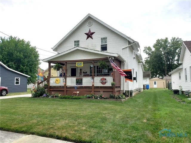 254 Fremont St, Elmore, OH 43416 - view of front facade featuring a front yard and a porch