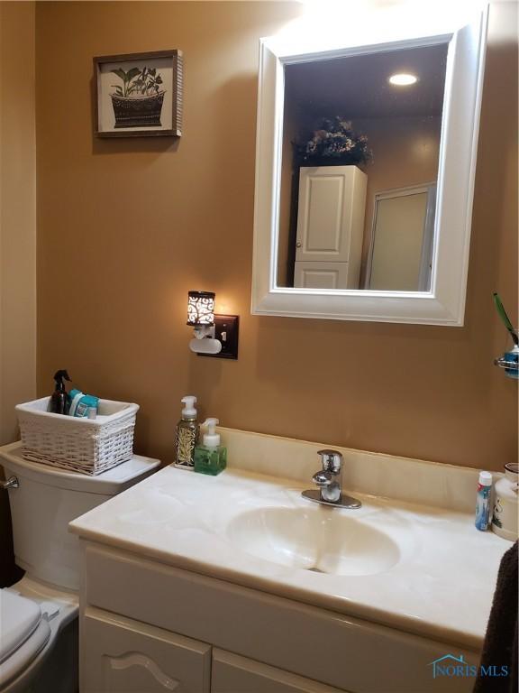 254 Fremont St, Elmore, OH 43416 - half bath featuring vanity and toilet