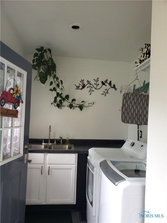 254 Fremont St, Elmore, OH 43416 - washroom featuring washing machine and clothes dryer and cabinet space