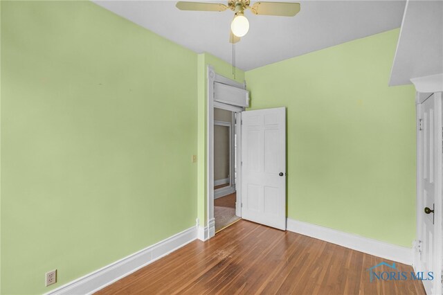 2008 N Main St, Findlay, OH 45840 - unfurnished bedroom with wood finished floors and ceiling fan