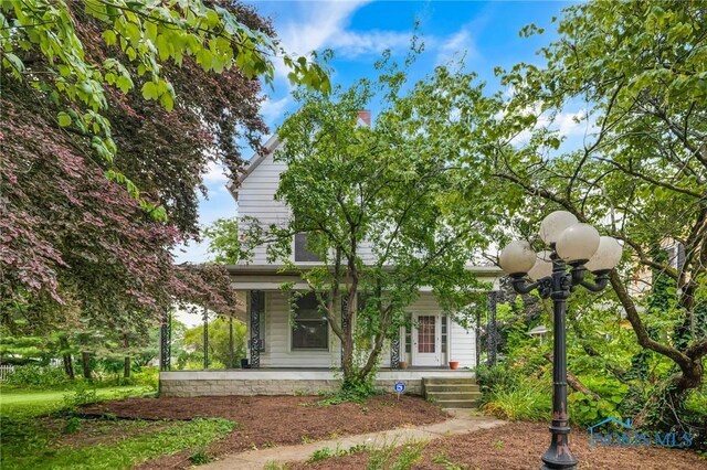 2008 N Main St, Findlay, OH 45840 - view of front of house featuring covered porch