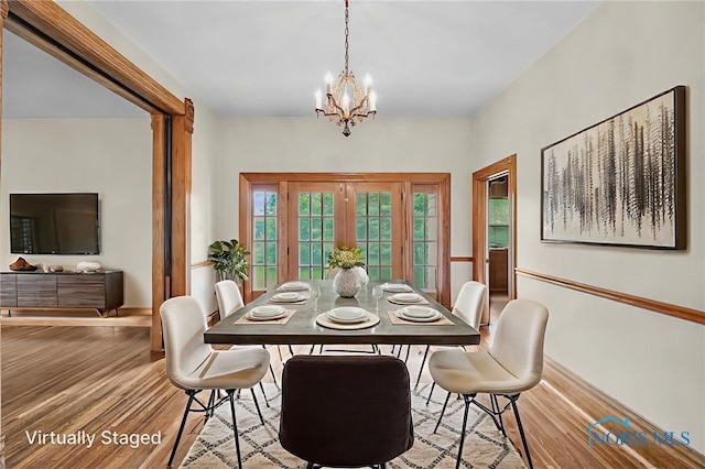 2008 N Main St, Findlay, OH 45840 - dining area featuring wood finished floors and a chandelier
