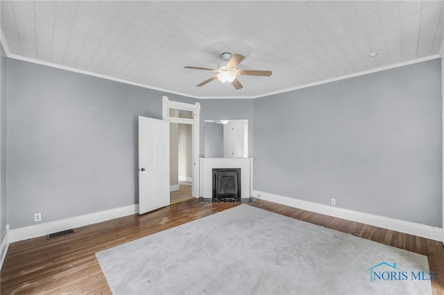 2008 N Main St, Findlay, OH 45840 - unfurnished living room featuring a ceiling fan, crown molding, wood finished floors, and a fireplace