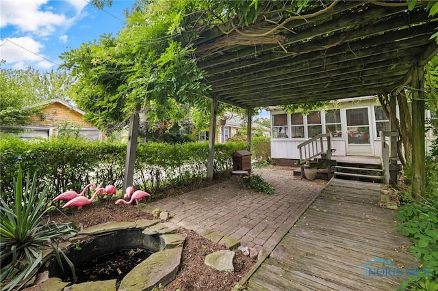 2008 N Main St, Findlay, OH 45840 - view of patio with a sunroom and a fire pit