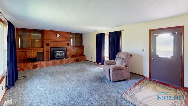 11232 Elm St, Dunbridge, OH 43414 - carpeted living area featuring healthy amount of natural light and a fireplace