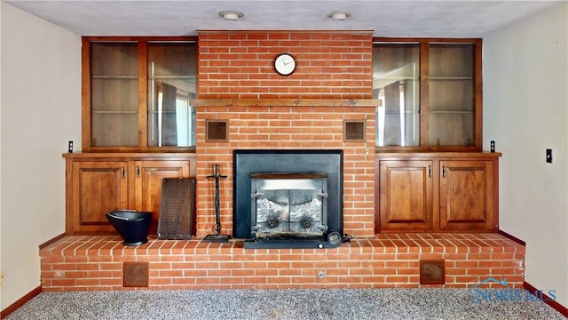 11232 Elm St, Dunbridge, OH 43414 - unfurnished living room featuring a brick fireplace and carpet flooring