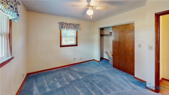 11232 Elm St, Dunbridge, OH 43414 - unfurnished bedroom with carpet floors, a closet, and a ceiling fan