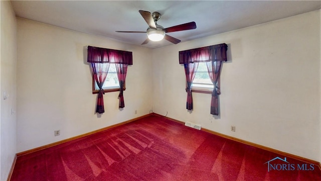 11232 Elm St, Dunbridge, OH 43414 - spare room with a ceiling fan and dark carpet