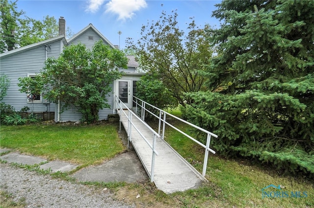 5660 Rd 180, Antwerp, OH 45813 - view of property exterior with a chimney, a yard, and roof with shingles