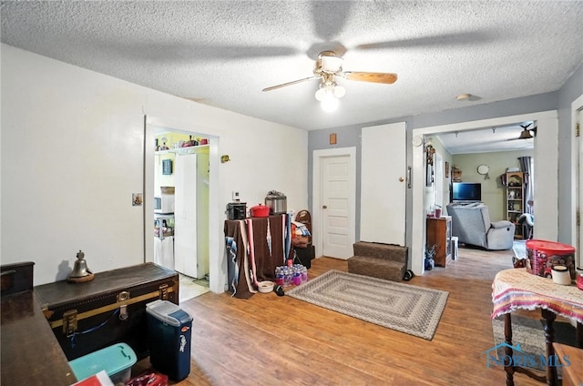 5660 Rd 180, Antwerp, OH 45813 - interior space with wood finished floors, ceiling fan, and a textured ceiling
