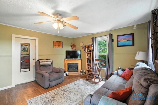 5660 Rd 180, Antwerp, OH 45813 - living room featuring ceiling fan, wood finished floors, and a fireplace