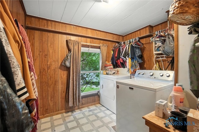 5660 Rd 180, Antwerp, OH 45813 - laundry room with washer and dryer, light floors, and wood walls