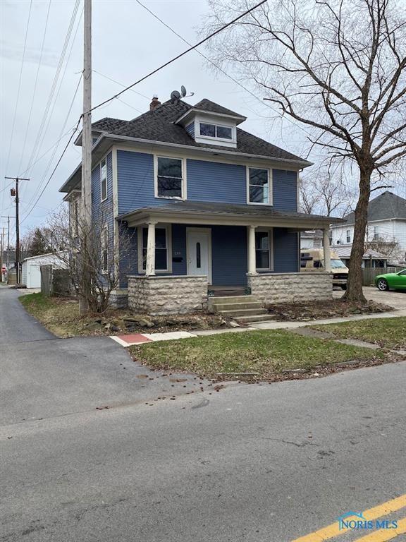 299 Circular St, Tiffin, OH 44883 - american foursquare style home with stone siding and covered porch