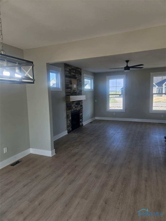 6332 Pimlico Rd, Whitehouse, OH 43571 - unfurnished living room featuring dark wood-style floors, a fireplace, and a ceiling fan