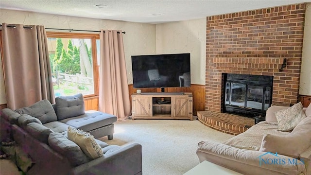 2359 Cheshire Woods Rd, Toledo, OH 43617 - carpeted living area featuring a textured ceiling, a brick fireplace, and wood walls
