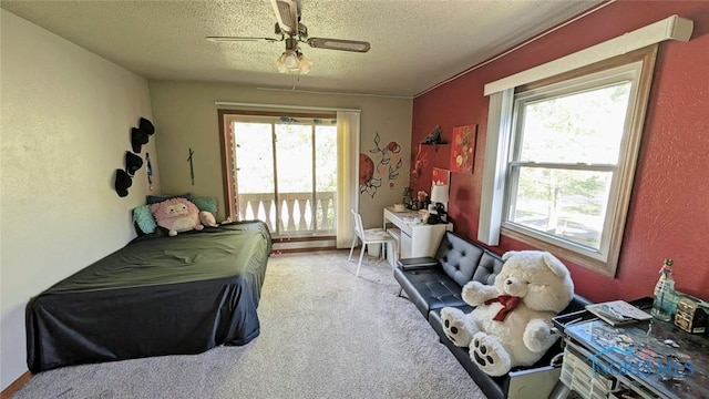 2359 Cheshire Woods Rd, Toledo, OH 43617 - bedroom with a textured ceiling, light colored carpet, and a ceiling fan