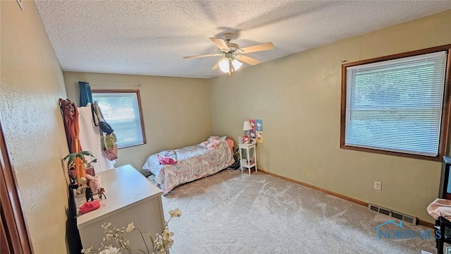 2359 Cheshire Woods Rd, Toledo, OH 43617 - bedroom with carpet floors, a textured ceiling, and ceiling fan
