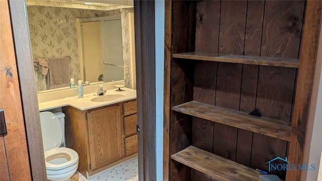 2359 Cheshire Woods Rd, Toledo, OH 43617 - bathroom with vanity, wallpapered walls, and a shower