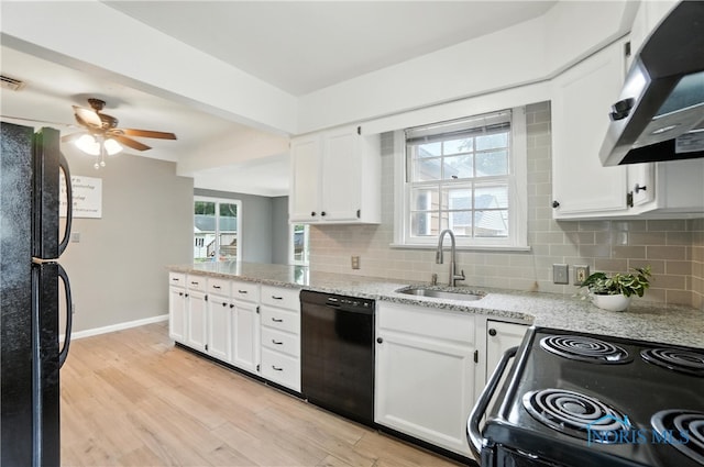 1447 Craigwood Rd, Toledo, OH 43612 - kitchen with black appliances, exhaust hood, tasteful backsplash, and white cabinetry