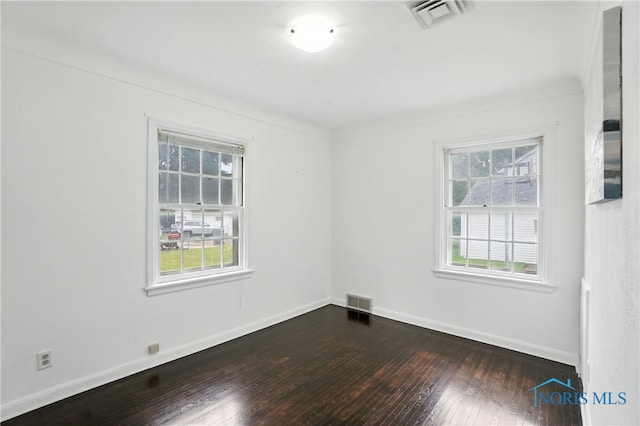 1447 Craigwood Rd, Toledo, OH 43612 - unfurnished room featuring plenty of natural light and dark wood-style floors
