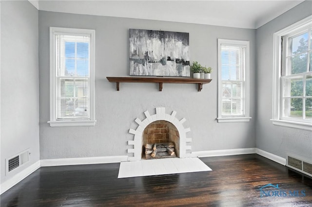 1447 Craigwood Rd, Toledo, OH 43612 - unfurnished living room featuring wood finished floors and a fireplace with flush hearth