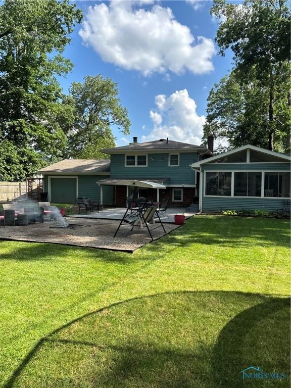 2920 Copland Blvd, Toledo, OH 43614 - back of house featuring a lawn and a patio