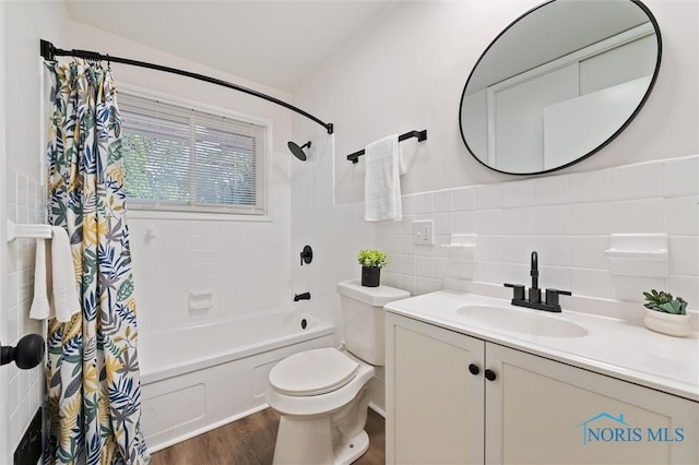 3129 Elmview Dr, Toledo, OH 43613 - bathroom featuring shower / bath combo with shower curtain, vanity, tile walls, and wood finished floors