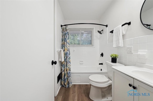 3129 Elmview Dr, Toledo, OH 43613 - bathroom featuring shower / bathtub combination with curtain, wood finished floors, tile walls, and vanity