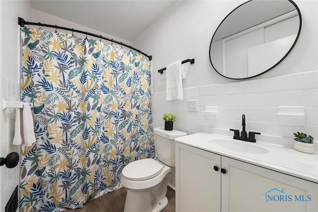 3129 Elmview Dr, Toledo, OH 43613 - bathroom with vanity, tile walls, a shower with shower curtain, and wood finished floors