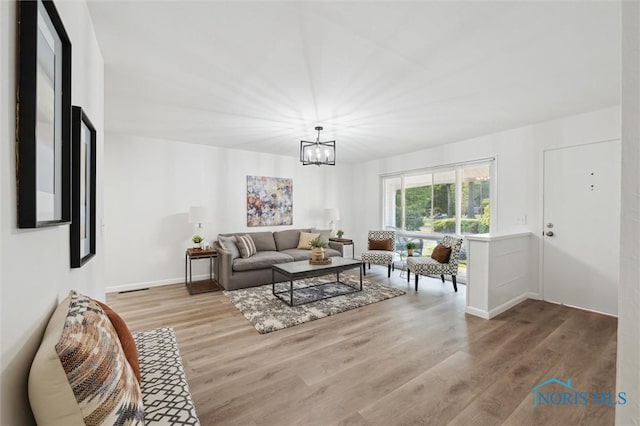 3129 Elmview Dr, Toledo, OH 43613 - living room with a chandelier and wood finished floors