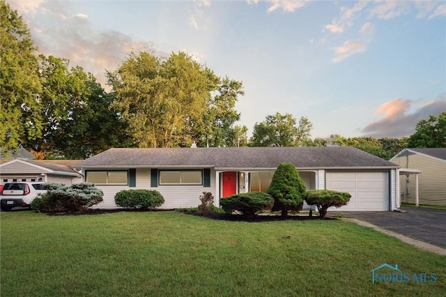 3129 Elmview Dr, Toledo, OH 43613 - single story home with driveway, a lawn, and an attached garage
