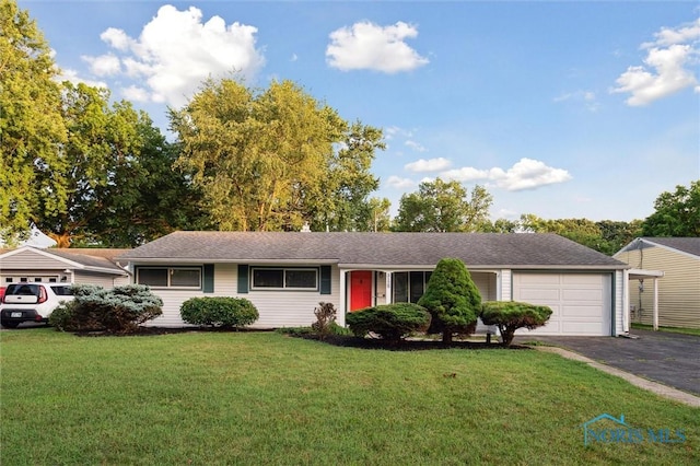 3129 Elmview Dr, Toledo, OH 43613 - single story home featuring driveway, an attached garage, a front yard, and a shingled roof