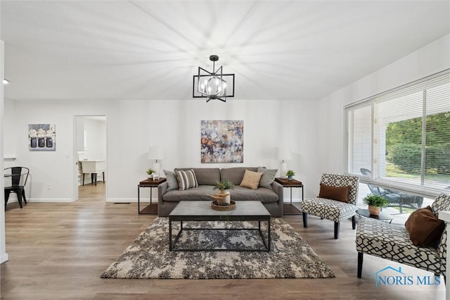 3129 Elmview Dr, Toledo, OH 43613 - living room with a chandelier and wood finished floors