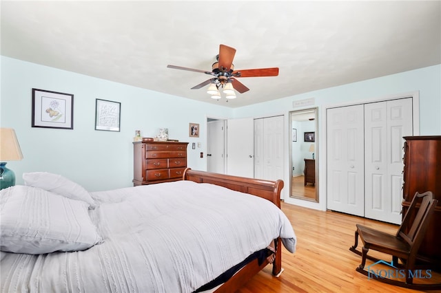 229 Hawthorn Dr, Archbold, OH 43502 - bedroom featuring multiple closets, light wood-style floors, and a ceiling fan