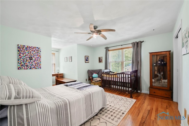 229 Hawthorn Dr, Archbold, OH 43502 - bedroom with light wood-style floors and a ceiling fan