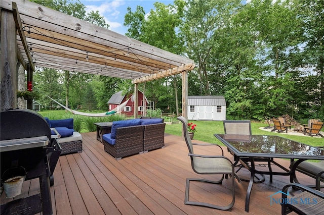 229 Hawthorn Dr, Archbold, OH 43502 - deck featuring outdoor dining space, an outdoor hangout area, a storage unit, a yard, and view of wooded area