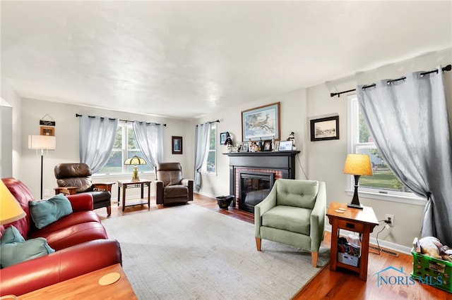 229 Hawthorn Dr, Archbold, OH 43502 - living room with wood finished floors and a brick fireplace