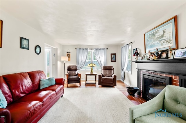229 Hawthorn Dr, Archbold, OH 43502 - living room featuring a brick fireplace