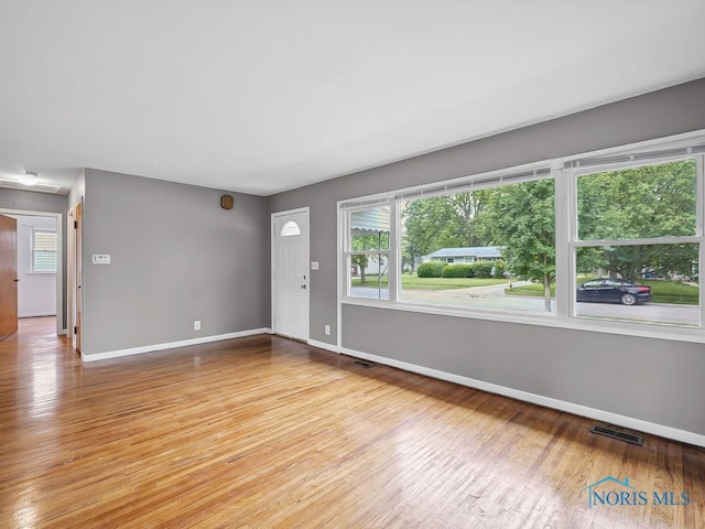 1242 Holgate Ave, Maumee, OH 43537 - unfurnished living room with light wood-style flooring