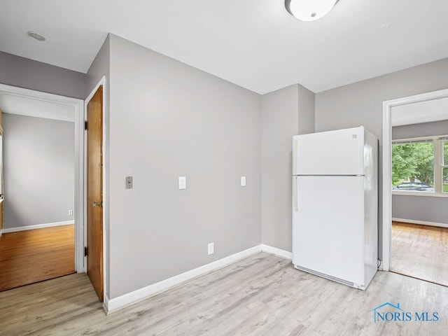 1242 Holgate Ave, Maumee, OH 43537 - kitchen with freestanding refrigerator and light wood-style floors