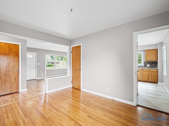 1242 Holgate Ave, Maumee, OH 43537 - unfurnished bedroom featuring light wood-type flooring and baseboards