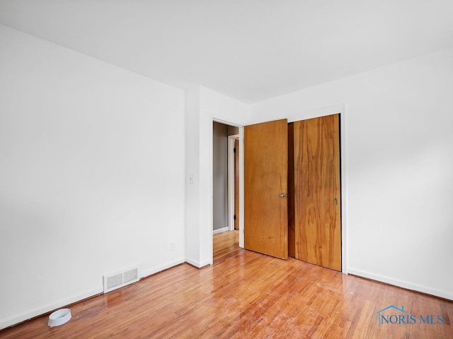 1242 Holgate Ave, Maumee, OH 43537 - unfurnished bedroom featuring light wood finished floors and a closet