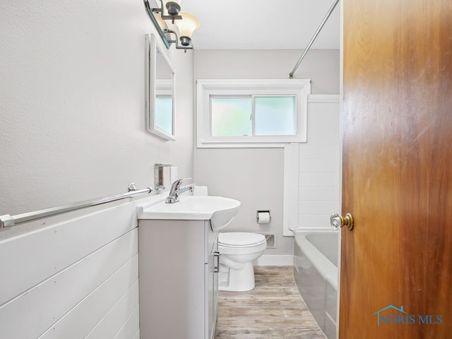 1242 Holgate Ave, Maumee, OH 43537 - full bathroom with vanity, wood finished floors, and  shower combination