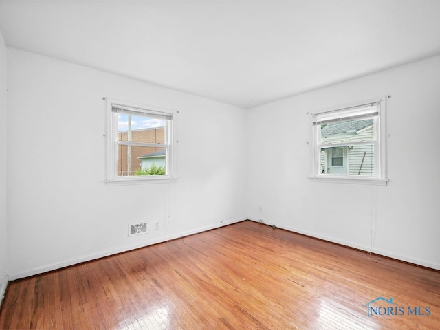 1242 Holgate Ave, Maumee, OH 43537 - spare room featuring hardwood / wood-style floors and baseboards