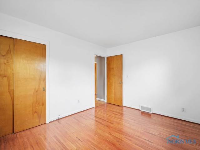 1242 Holgate Ave, Maumee, OH 43537 - unfurnished bedroom with wood finished floors and baseboards