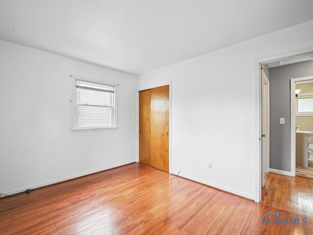 1242 Holgate Ave, Maumee, OH 43537 - empty room with light wood-style flooring and healthy amount of natural light