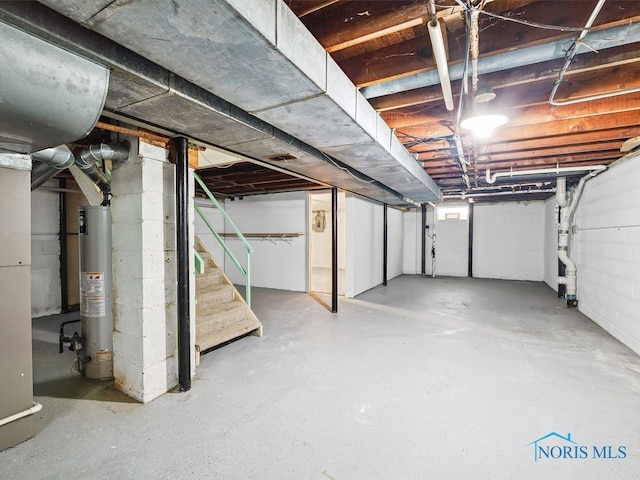 1242 Holgate Ave, Maumee, OH 43537 - unfinished below grade area featuring water heater and stairway