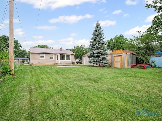 1242 Holgate Ave, Maumee, OH 43537 - view of green lawn with a storage unit